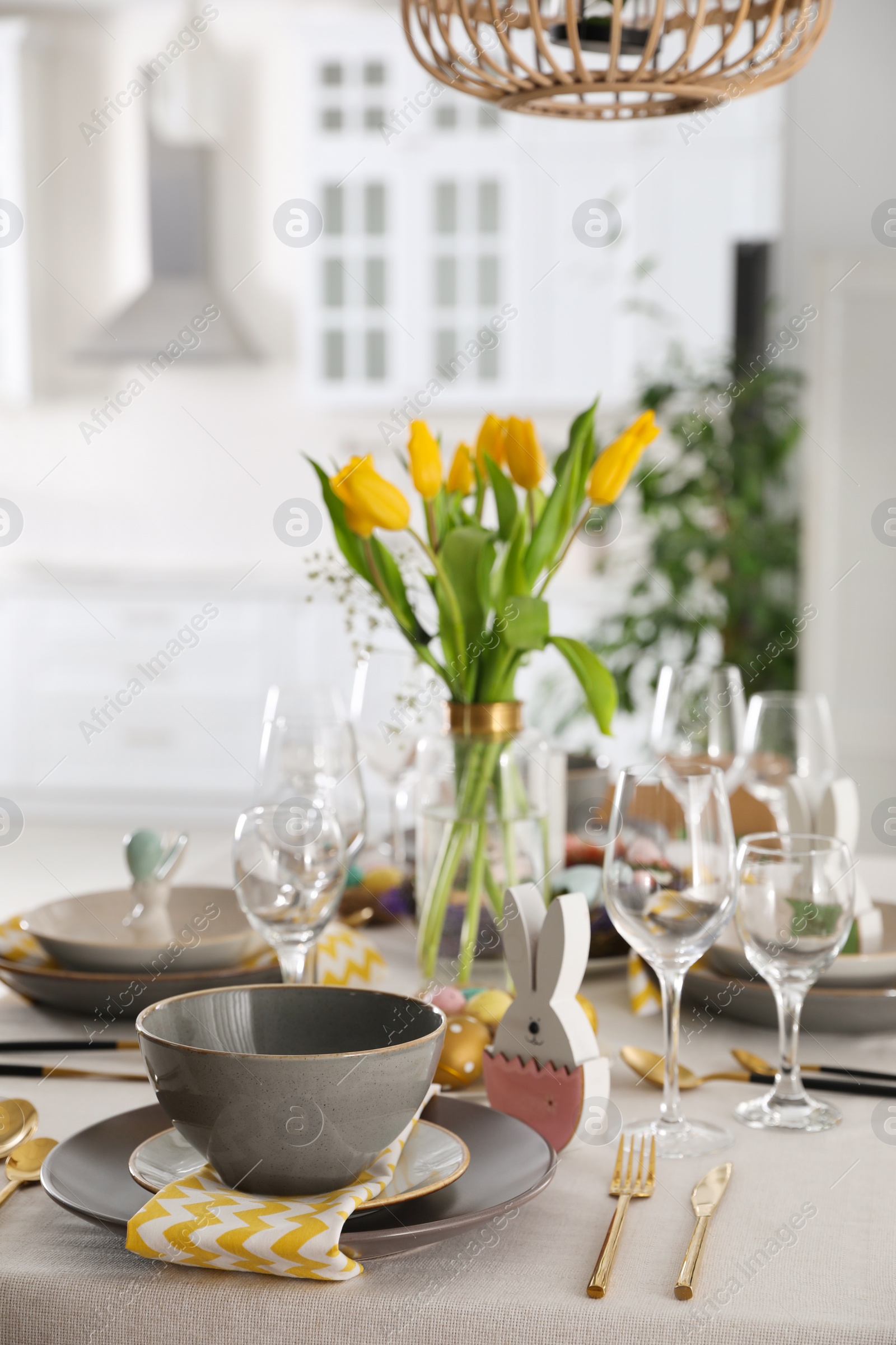 Photo of Beautiful Easter table setting with festive decor indoors