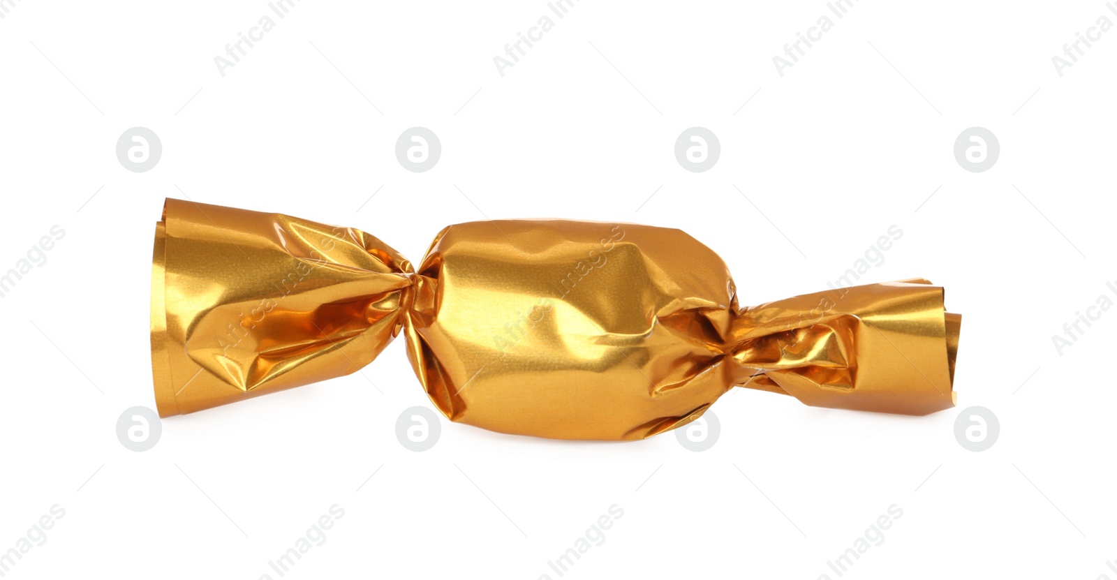 Photo of Delicious candy in golden wrapper isolated on white