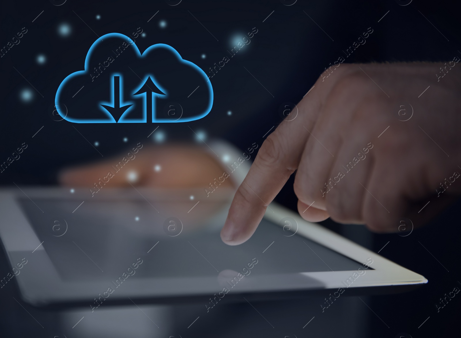 Image of Cloud computing and storage concept. Man using tablet on dark background, closeup