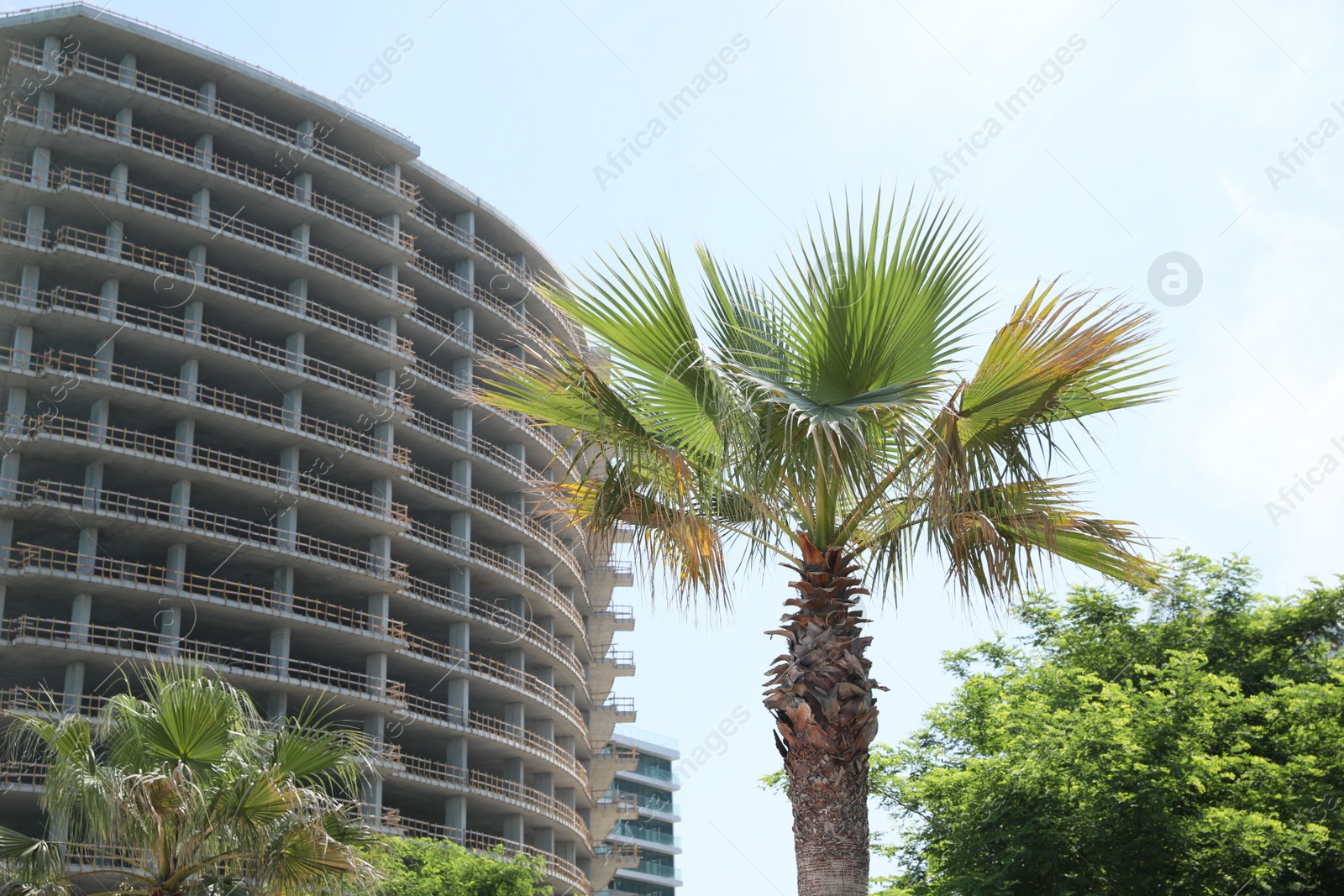 Photo of Batumi, Georgia - June 06, 2022: View of unfinished building and trees outdoors