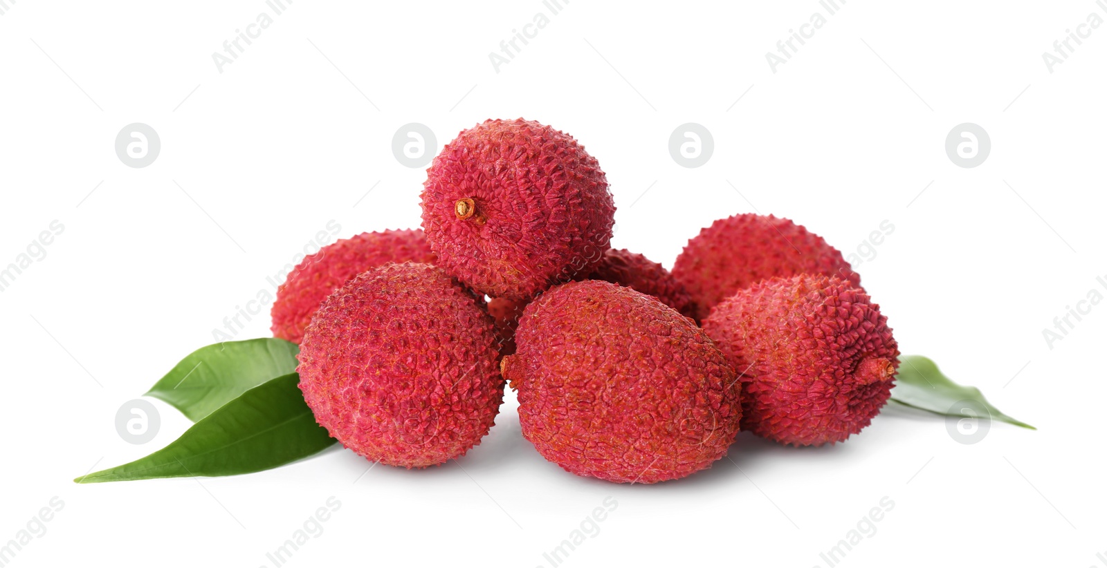 Photo of Pile of fresh ripe lychees with green leaves on white background