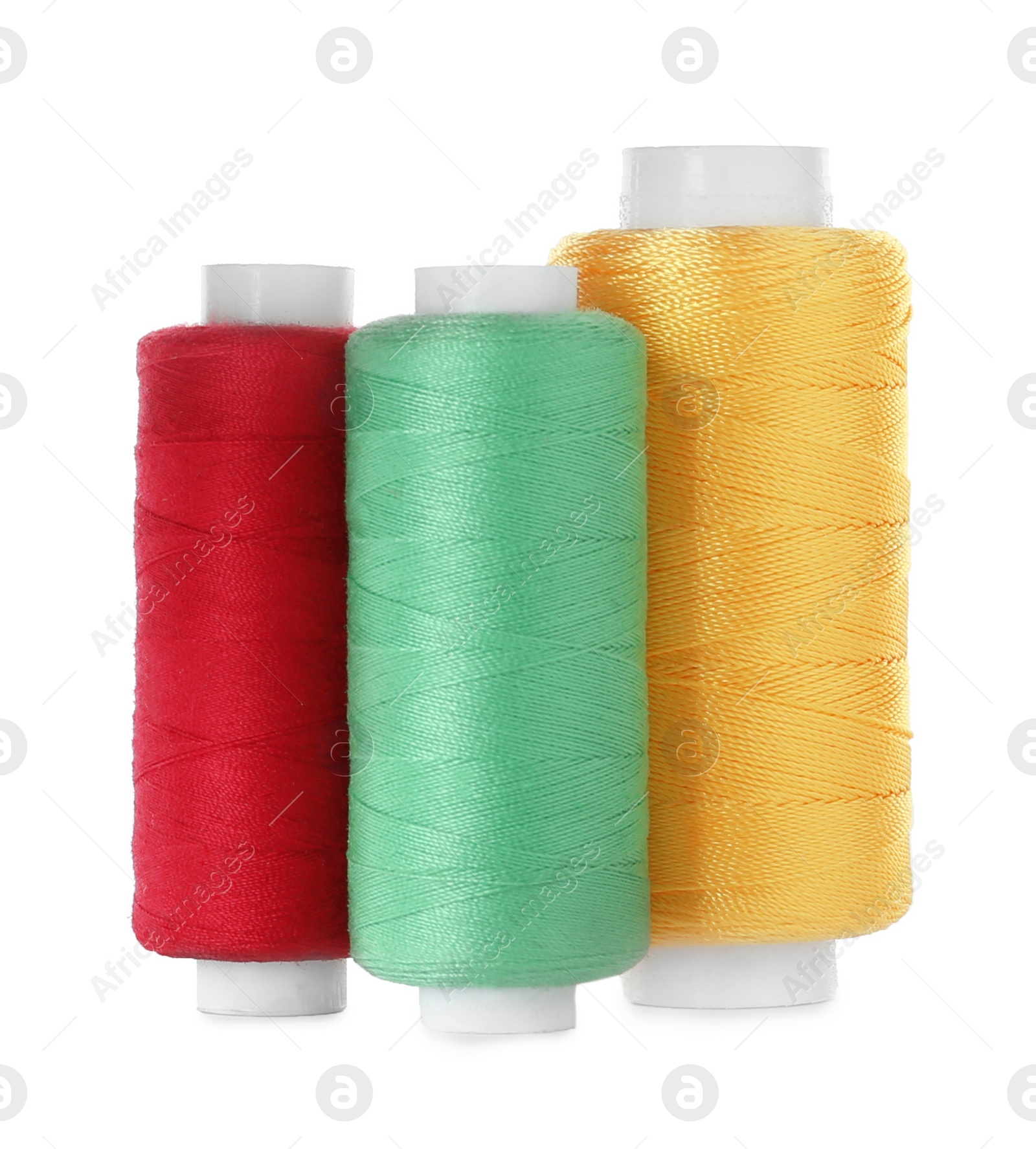 Photo of Set of color sewing threads isolated on white