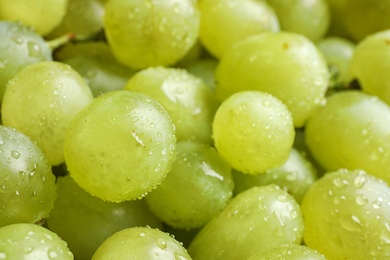 Fresh ripe juicy white grapes as background, closeup view