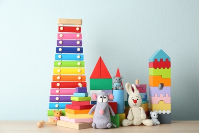 Set of different toys on wooden table