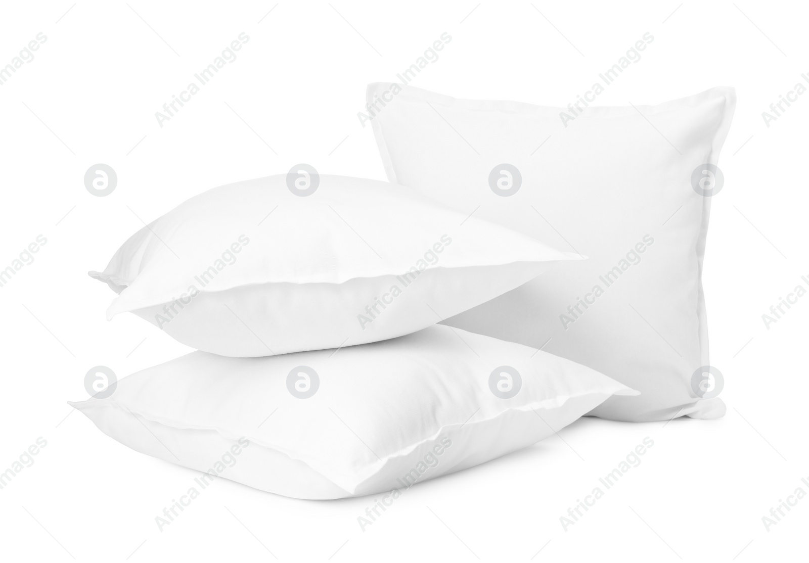 Photo of Three new soft pillows isolated on white