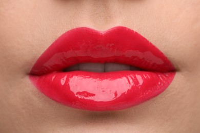 Photo of Woman with bright lip gloss, closeup view