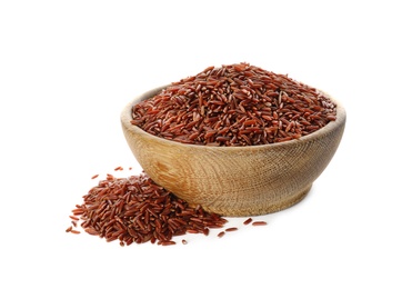 Wooden bowl with brown rice on white background