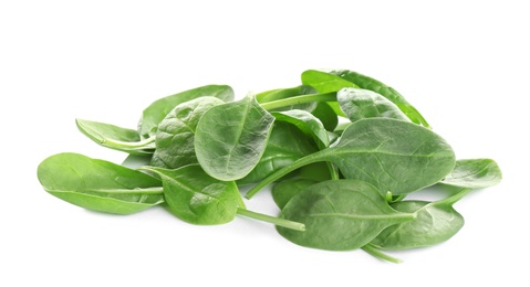 Pile of fresh green healthy baby spinach leaves on white background