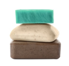 Stack of different soap bars on white background