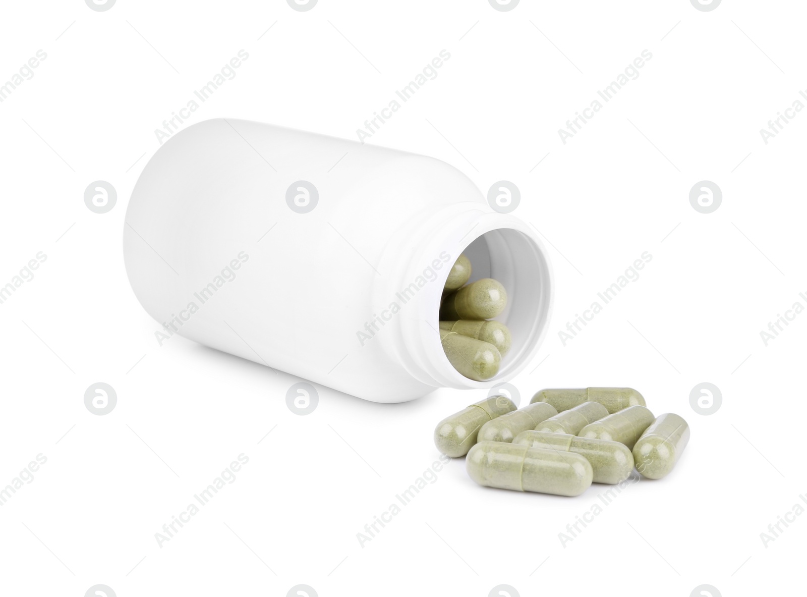 Photo of Vitamin capsules and medical bottle isolated on white