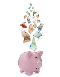 Image of Euro banknotes falling into pink piggy bank on white background