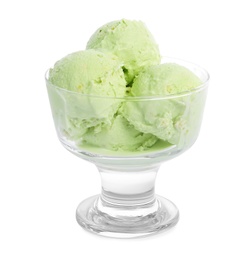 Photo of Dishware of sweet pistachio ice cream on white background