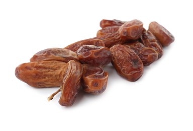 Photo of Sweet dates on branch against white background. Dried fruit as healthy snack