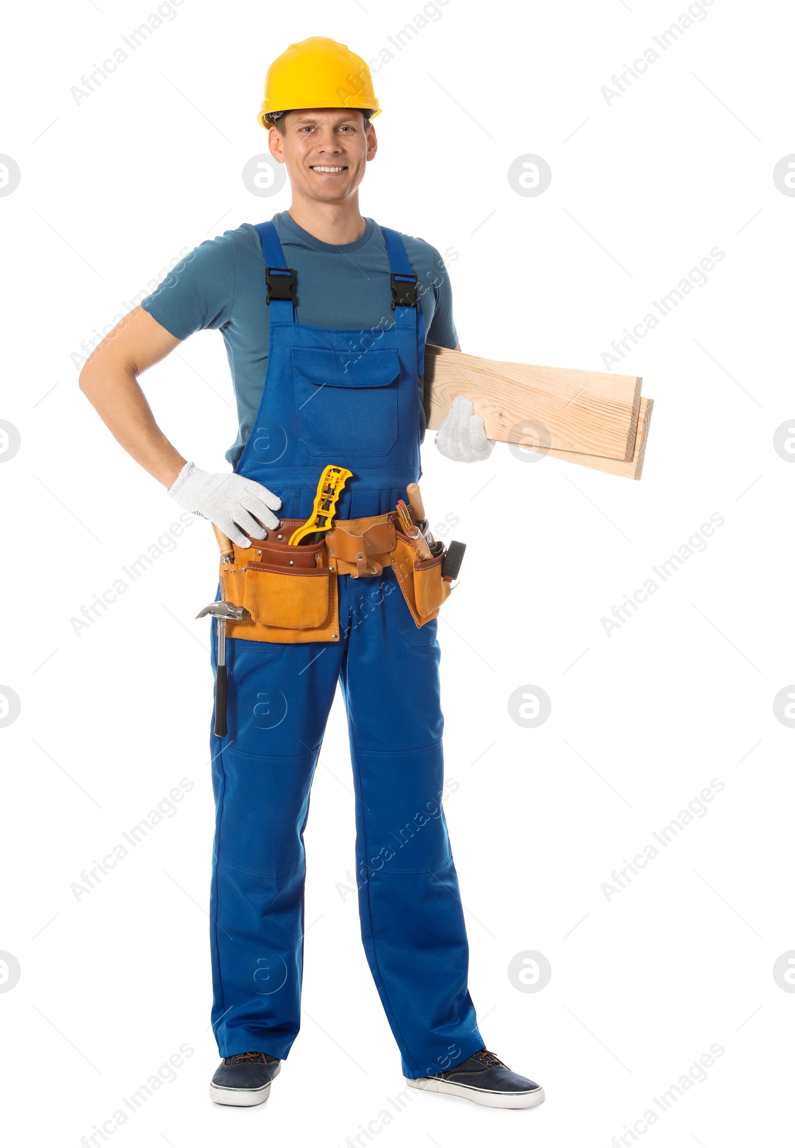 Photo of Handsome carpenter with wooden planks isolated on white