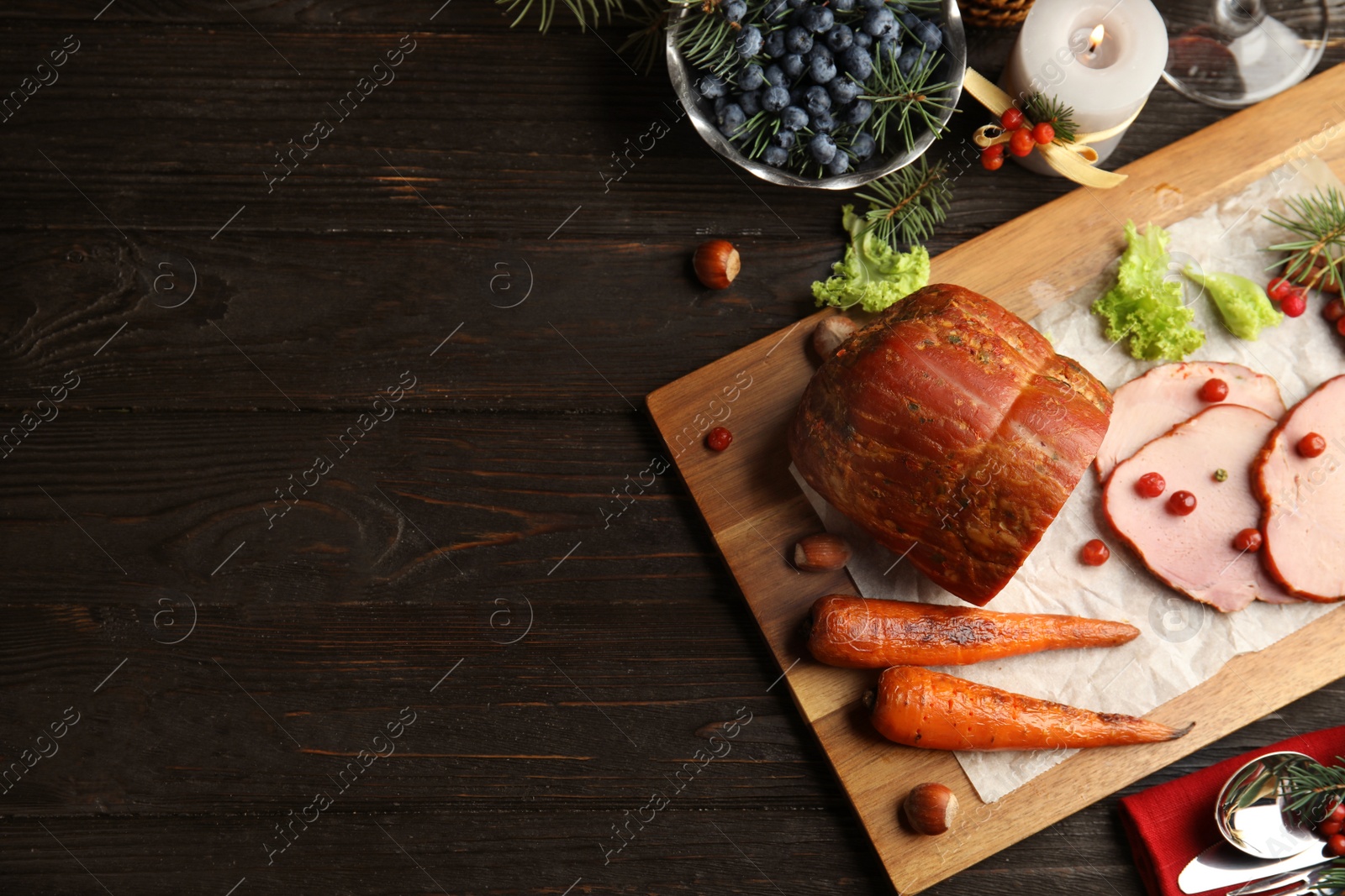 Photo of Flat lay composition with delicious ham on black wooden table, space for text. Christmas dinner