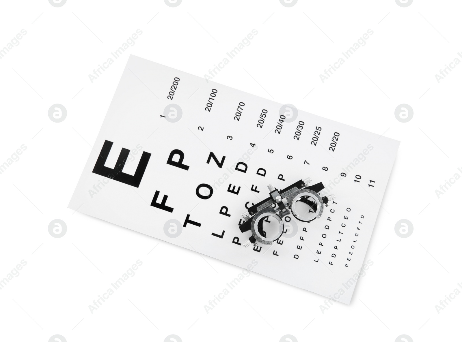 Photo of Eye chart test and trial frame on white background, top view. Ophthalmologist tools