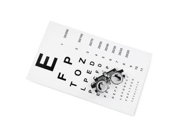 Photo of Eye chart test and trial frame on white background, top view. Ophthalmologist tools