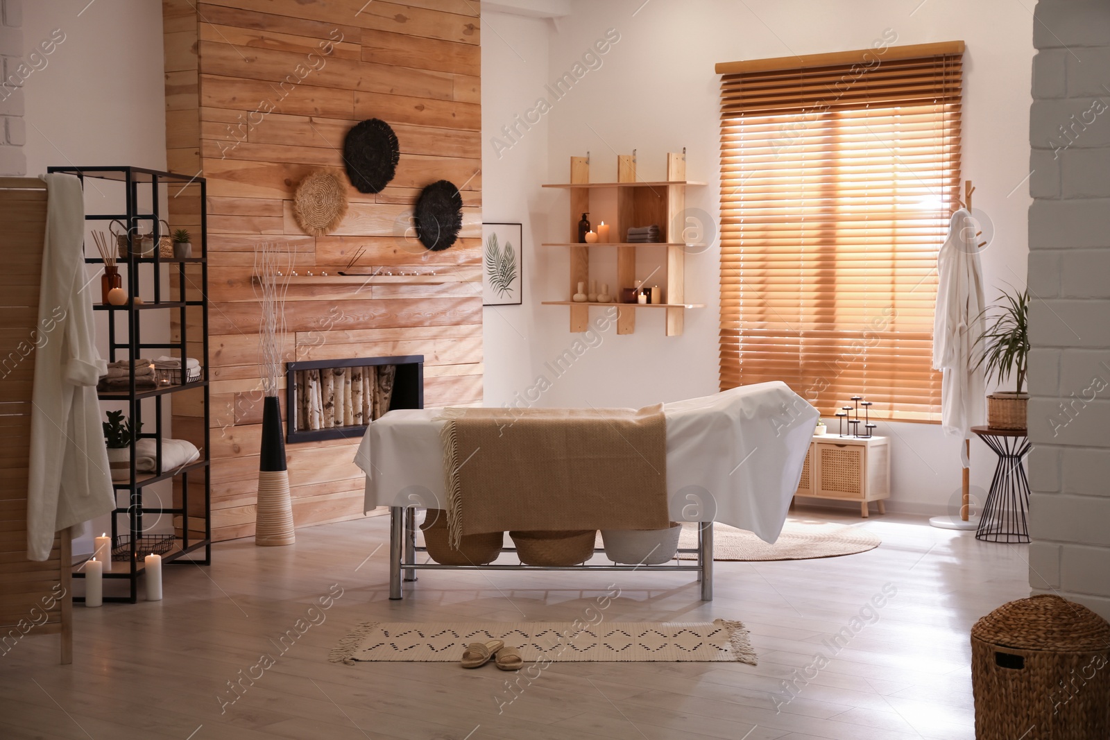 Photo of Stylish massage room interior in spa salon