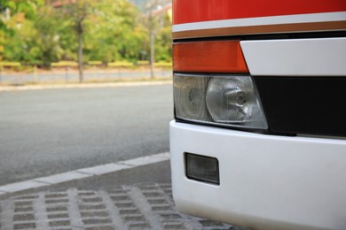 Modern bus on autumn day outdoors, closeup and space for text. Public transport