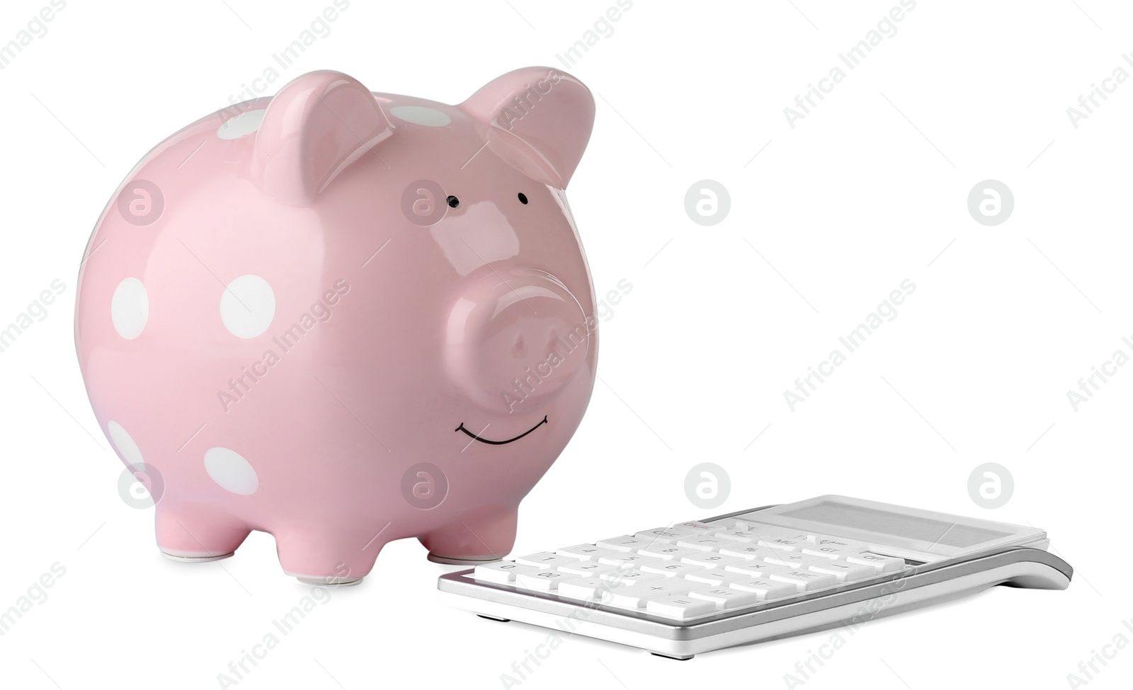 Photo of Calculator and pink piggy bank isolated on white