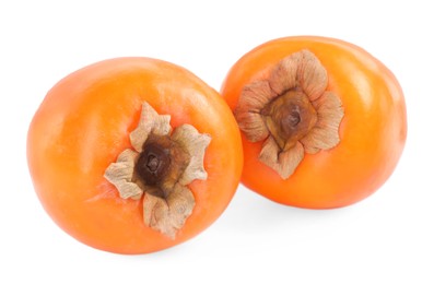 Photo of Delicious ripe juicy persimmons isolated on white