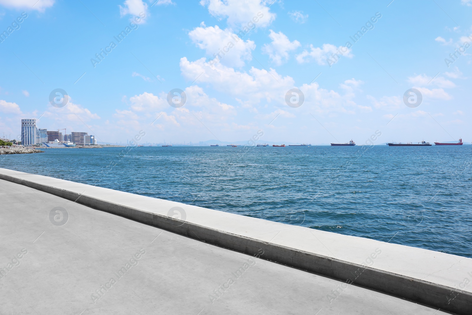 Photo of Beautiful seascape with modern buildings and vessels on sunny day
