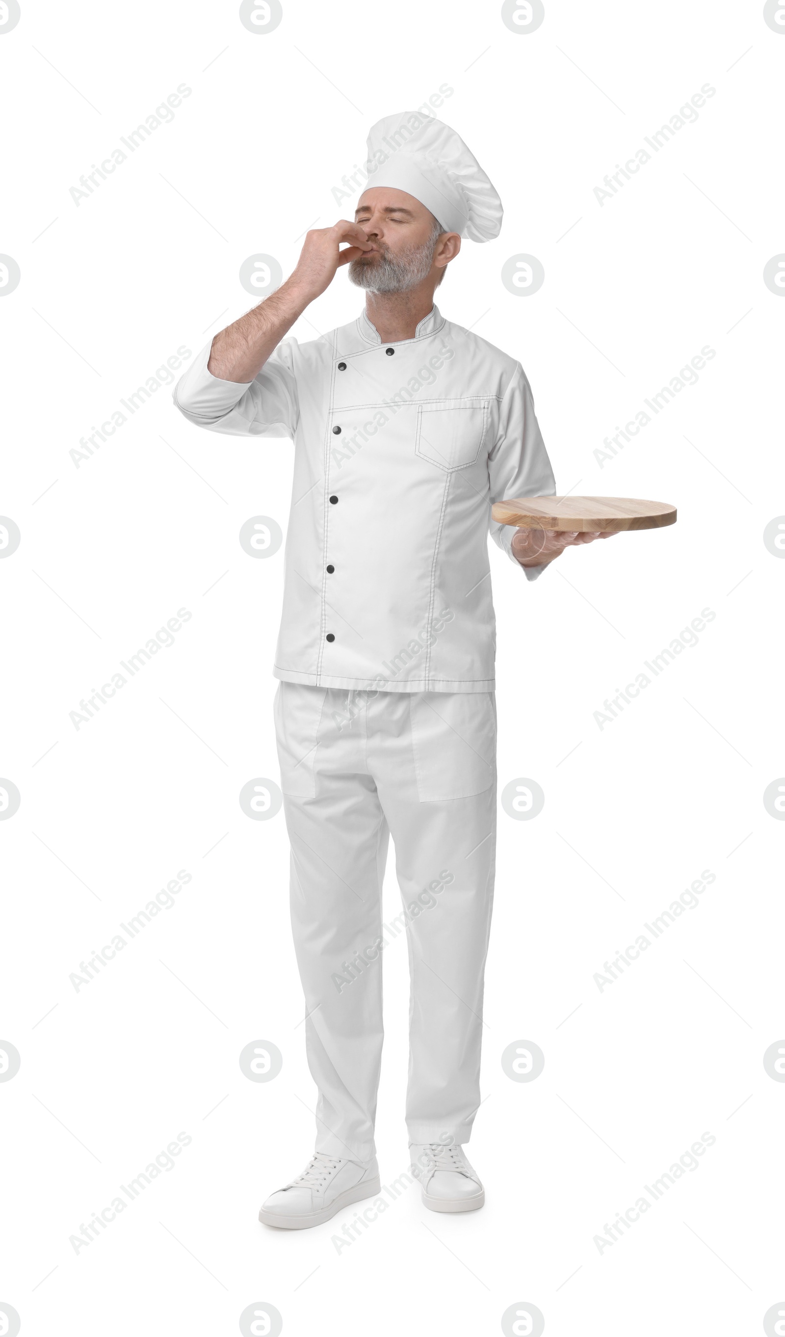 Photo of Chef in uniform with wooden board showing perfect sign on white background