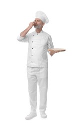 Photo of Chef in uniform with wooden board showing perfect sign on white background