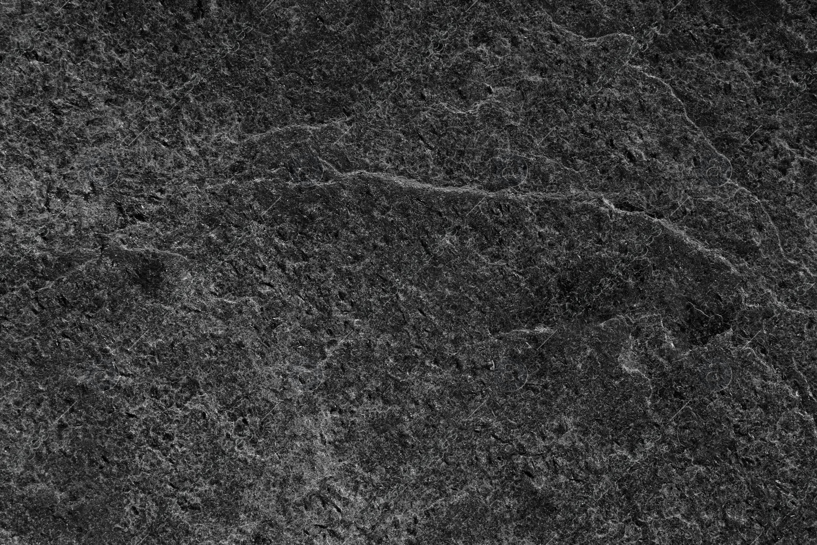 Image of Texture of dark grey stone surface as background, closeup