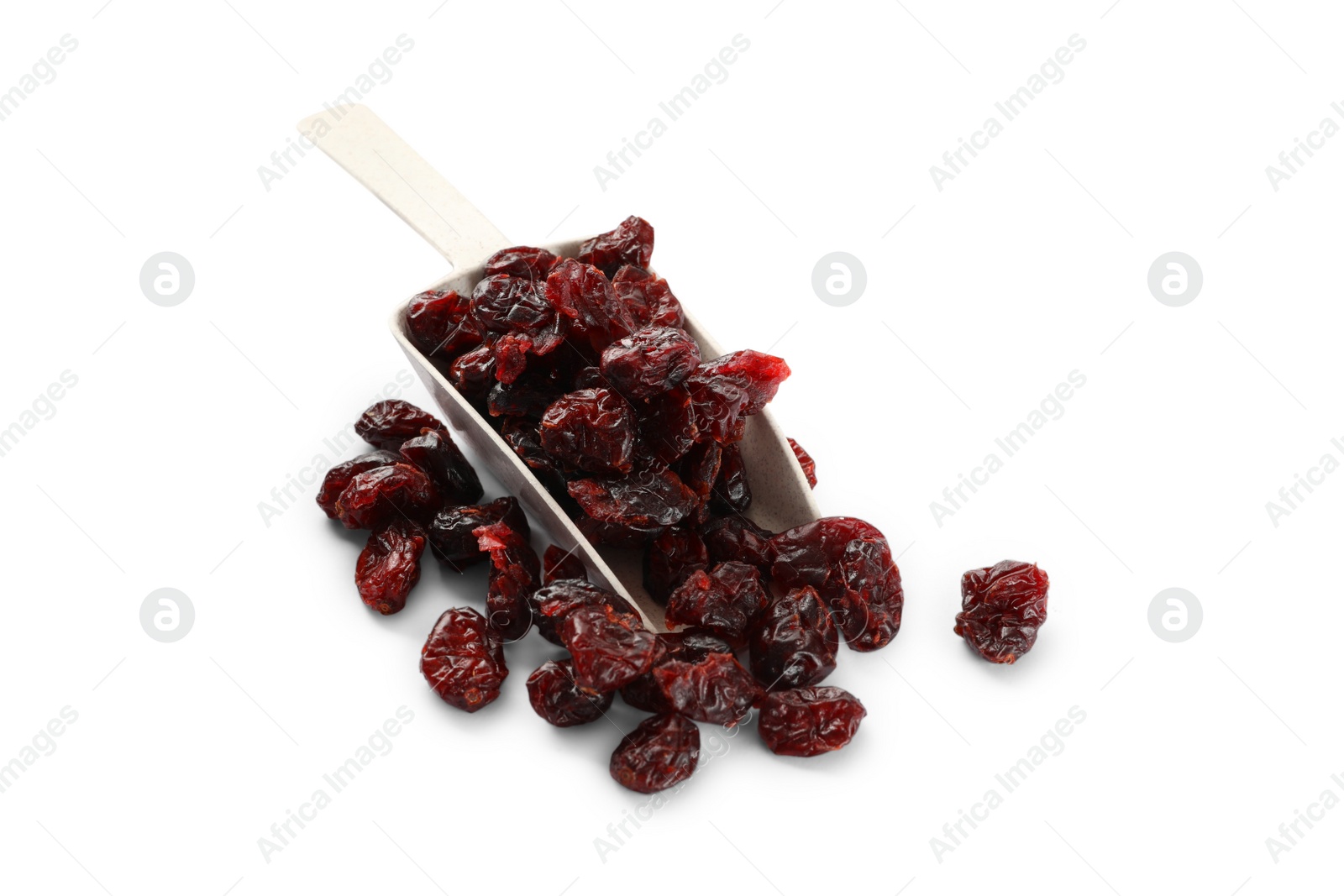 Photo of Tasty dried cranberries and scoop isolated on white