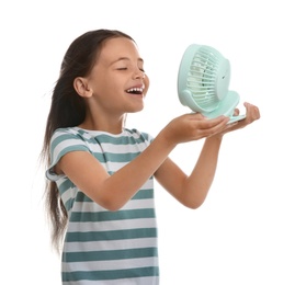 Photo of Little girl enjoying air flow from portable fan on white background. Summer heat