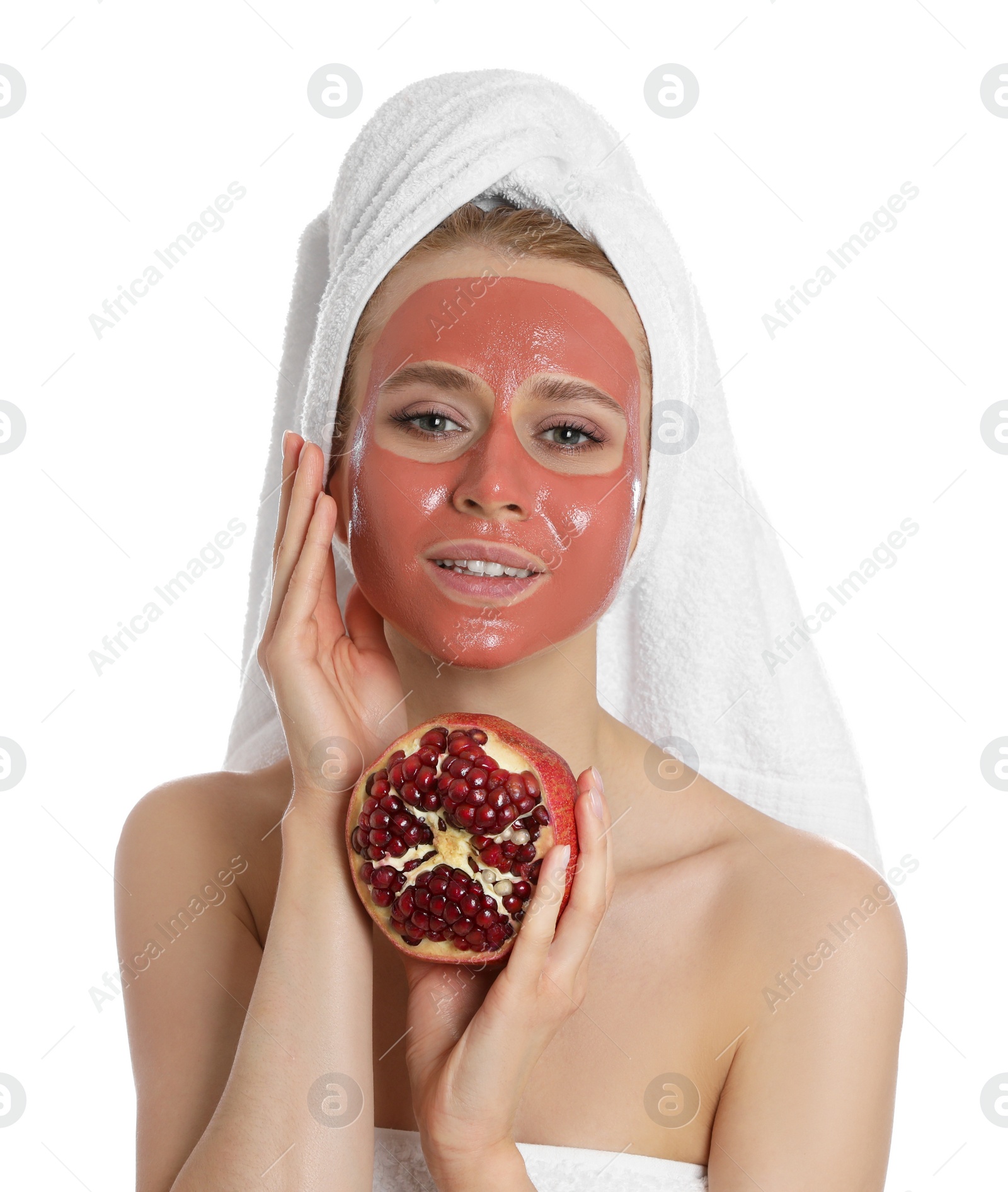 Photo of Young woman with pomegranate face mask and fresh fruit on white background