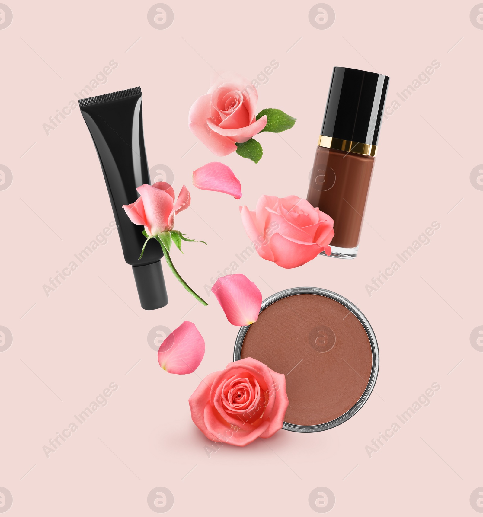 Image of Different makeup products and beautiful roses in air on beige pink background