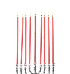 Silver menorah with burning candles on white background. Hanukkah celebration