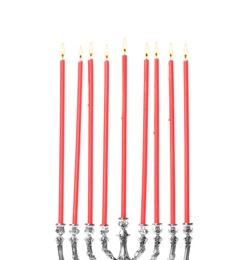 Photo of Silver menorah with burning candles on white background. Hanukkah celebration