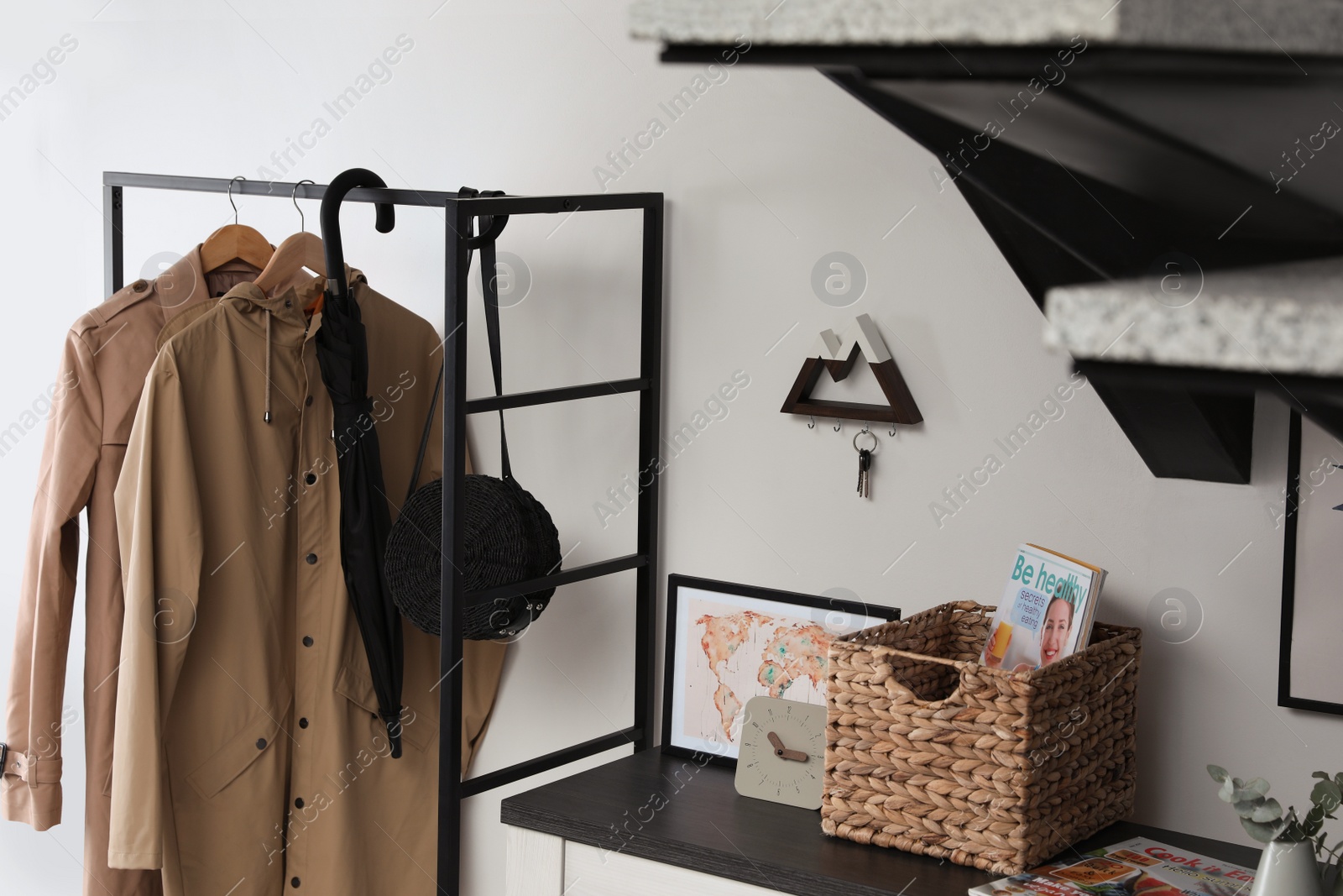 Photo of Modern hallway interior with stylish furniture and key holder