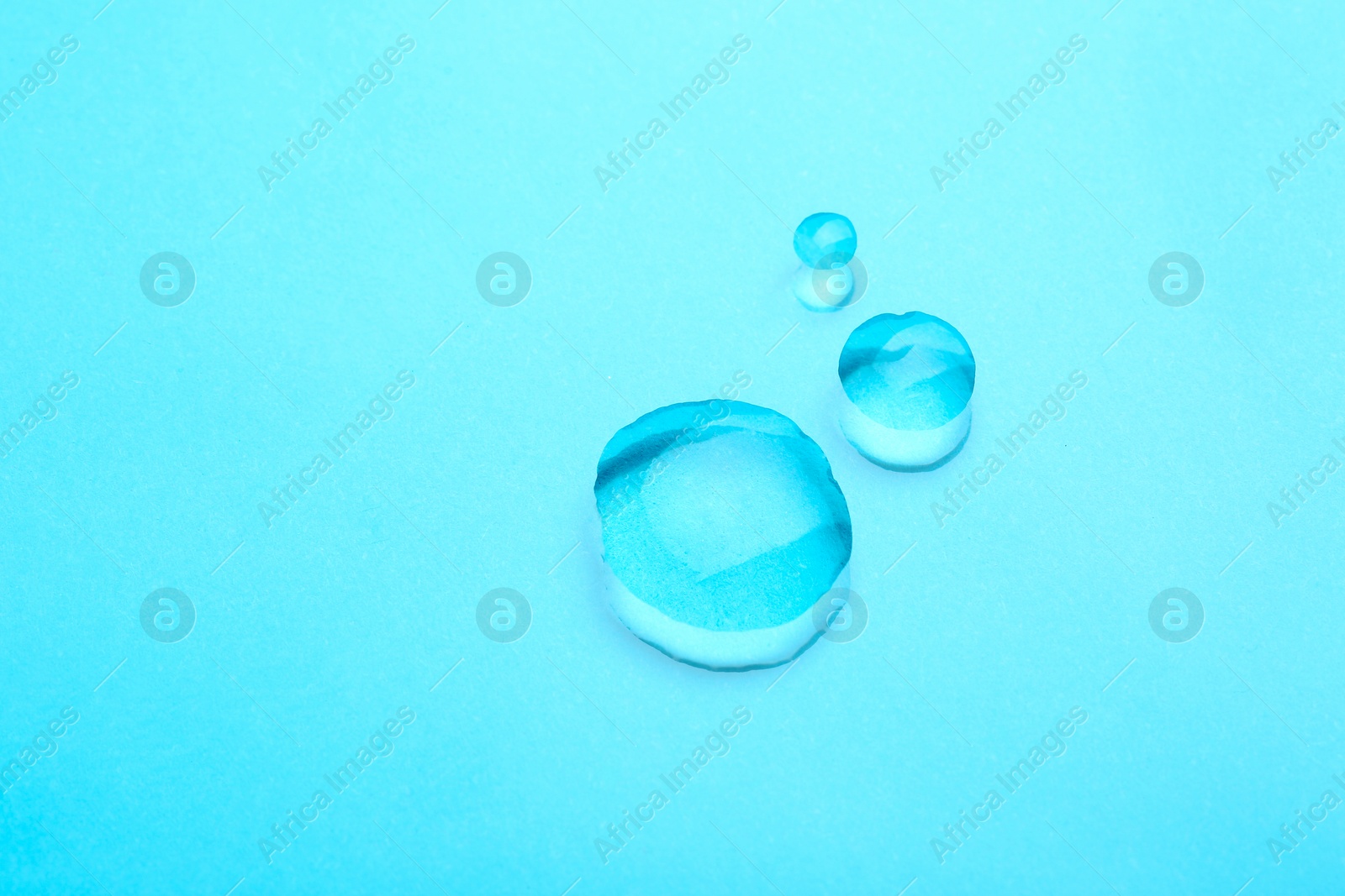 Photo of Water drops on color background, top view. Space for text