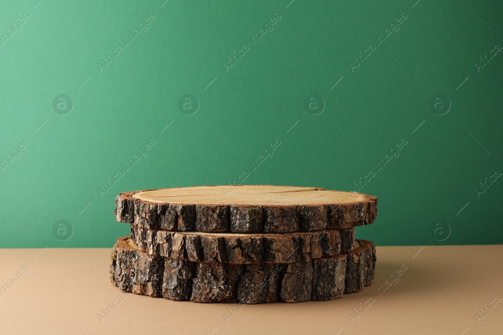 Photo of Presentation for product. Wooden stumps on color background. Space for text