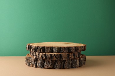 Photo of Presentation for product. Wooden stumps on color background. Space for text