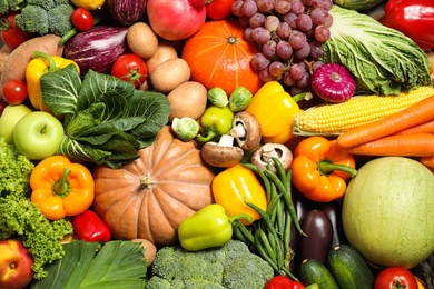 Photo of Assortment of organic fresh fruits and vegetables as background, closeup