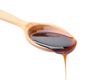 Photo of Wooden spoon with delicious caramel syrup isolated on white