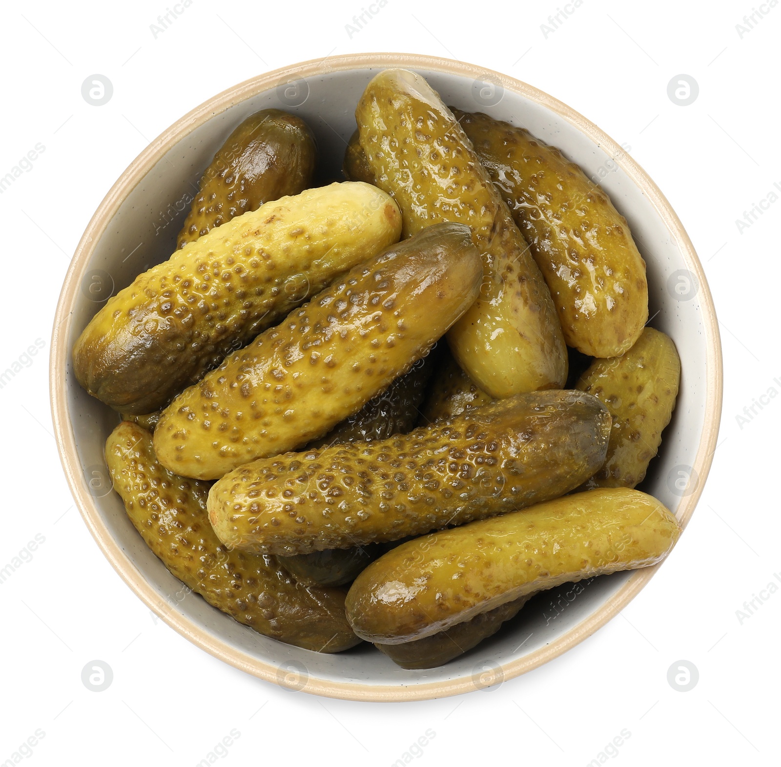 Photo of Tasty pickled cucumbers in bowl isolated on white, top view