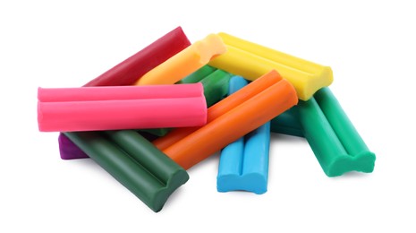 Many different colorful plasticine pieces on white background