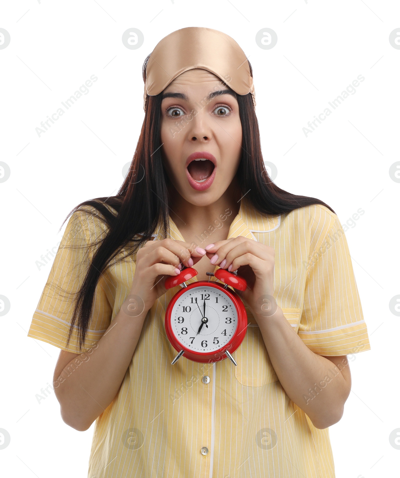 Photo of Emotional overslept woman with alarm clock on white background. Being late concept