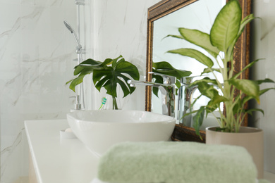 Vintage mirror and vessel sink in stylish bathroom