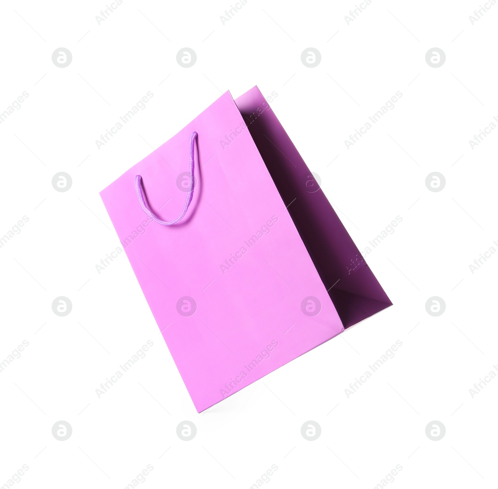 Photo of One violet shopping bag isolated on white