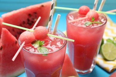 Tasty watermelon drink with fresh fruit and mint, closeup