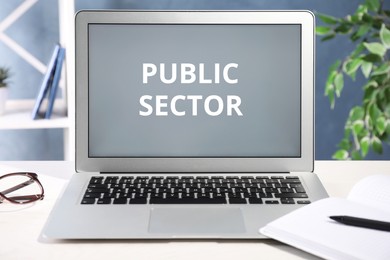 Image of Public Sector. Modern laptop on table in office
