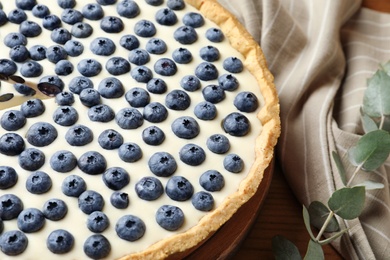 Photo of Tasty cake with blueberry on table, closeup