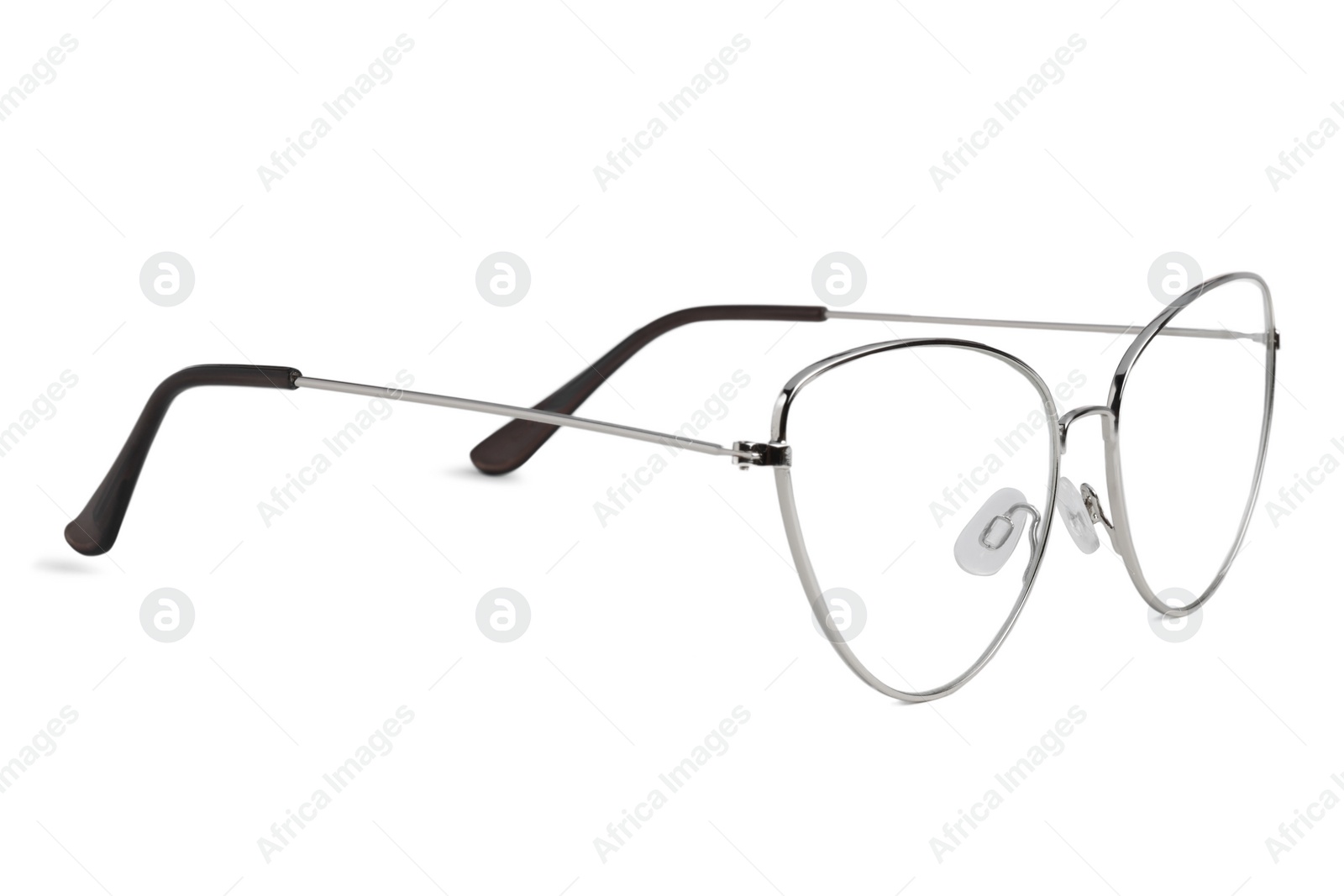 Photo of Stylish glasses with metal frame isolated on white